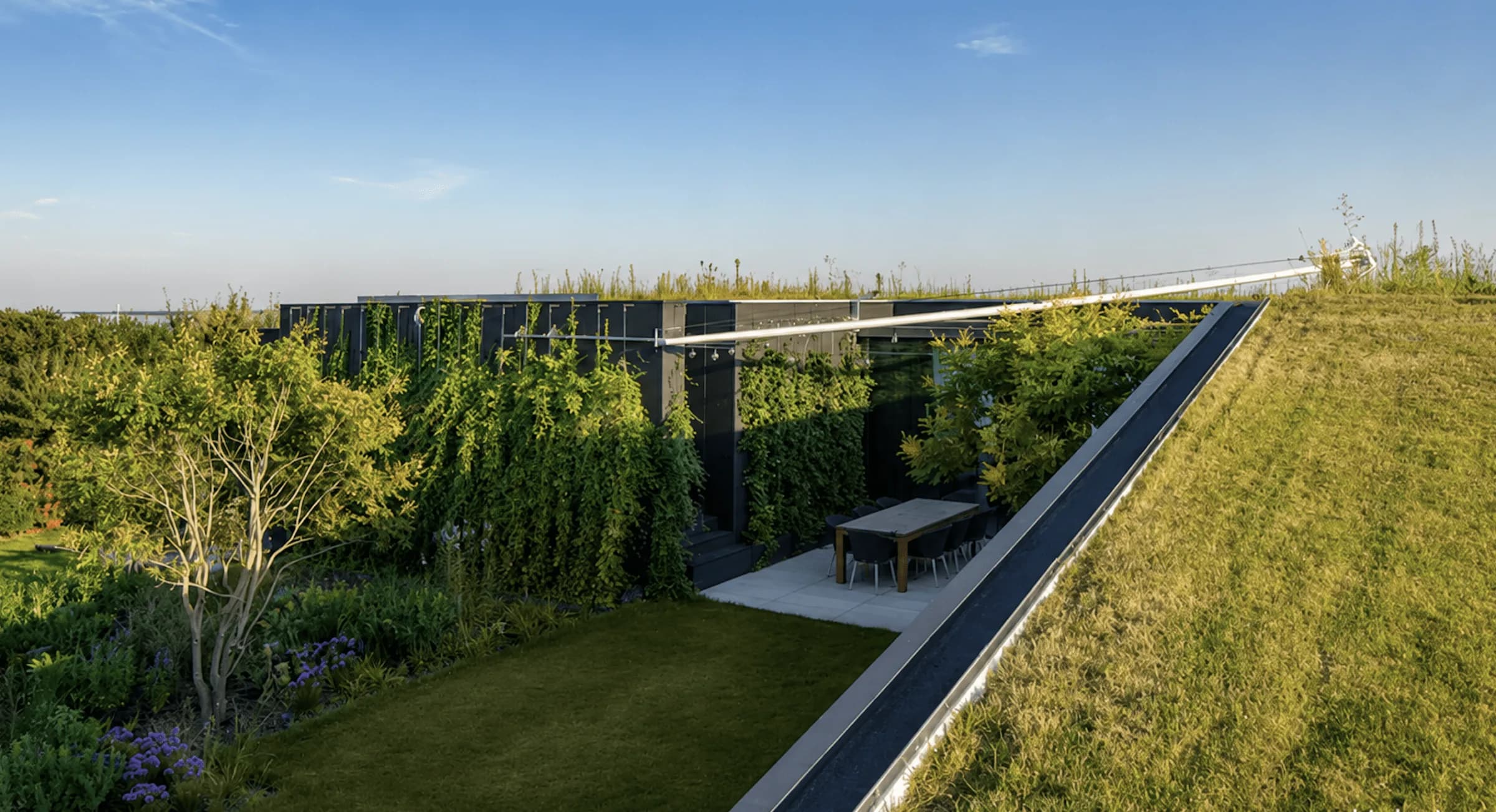 Villa on the Lake Geneva arc with a green roof, sunken garden and terrace